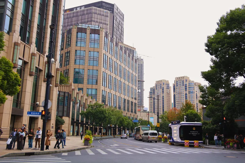 View of modern buildings and streets in Shanghai, China, showcasing urban architecture.